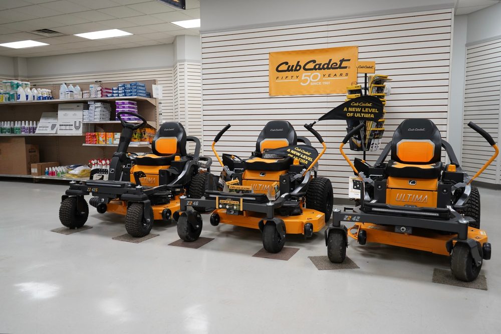 Cub Cadet Ultima zero-turn mowers on display under the Cub Cadet banner